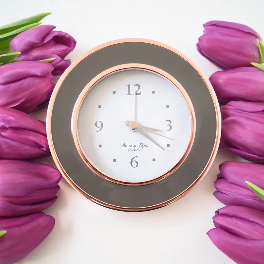 Addison Ross Rose Gold Taupe Enamel Clock with flowers in a room