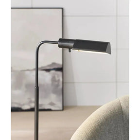 Visual Comfort Studio Adjustable Floor Lamp in Bronze in a room