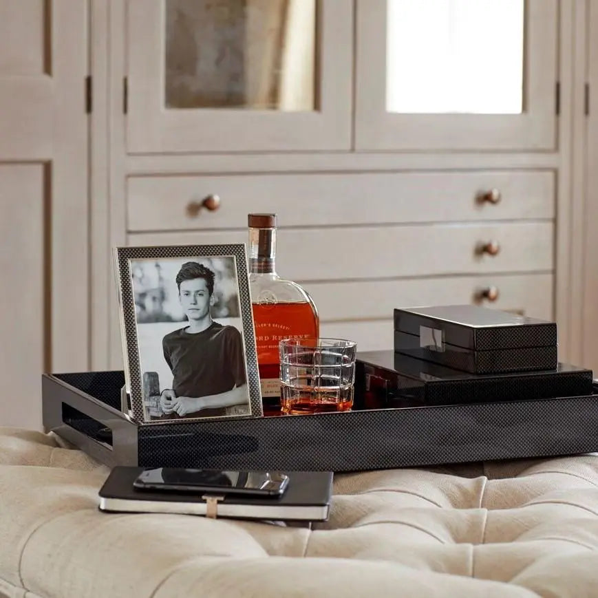 Addison Ross Carbon Fibre Frame set on a serving tray with whisky and old fashioned glass in a room