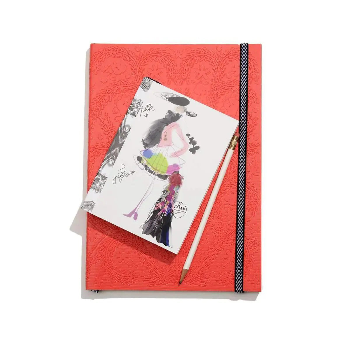 Hachette Christian Lacroix Croquis Fashion A6 Sketch Notebook set on top of a large scarlet red Christian Lacroix Paseo Notebook