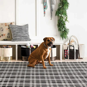 Dash and Albert Tattersall Black Ecru Cotton Woven Rug in a room
