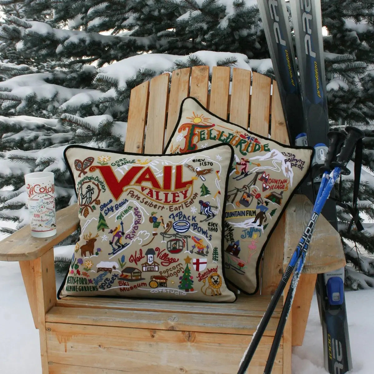 Catstudio Ski Vail Pillow outside in the snow on a chair