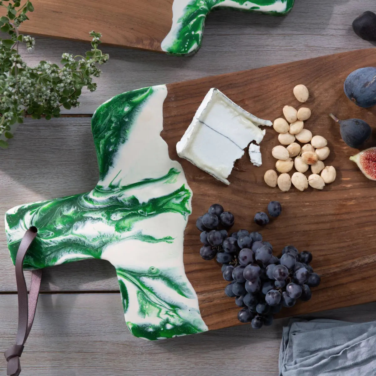 Blue Pheasant Austin Swirled Green Resin, Natural Teak Serving Board with blueberries, nuts and food in a room