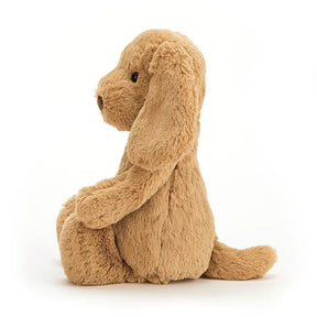 Side view of Jellycat Bashful Toffee Puppy