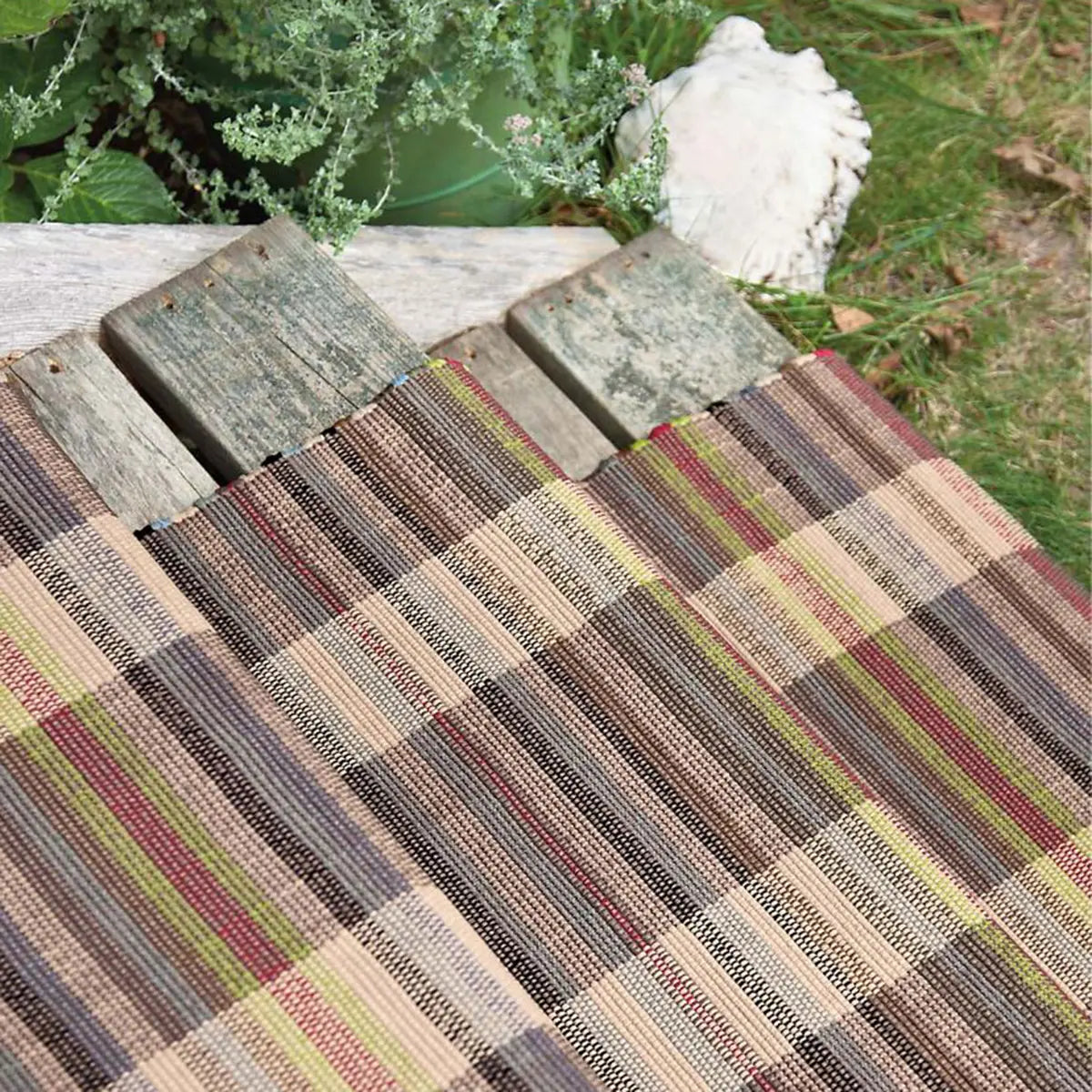 Dash and Albert Swedish Rag Indoor Outdoor Rug outside on wooden staircase