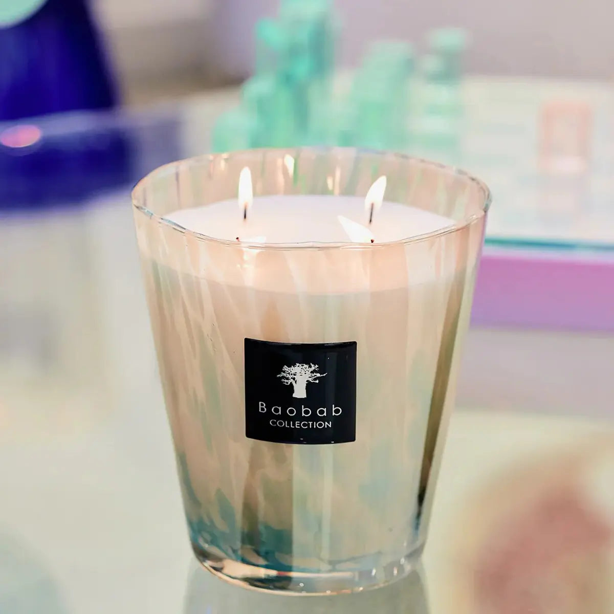 Baobab Collection Max 16 Pearls White Candle lit in a room on a glass table