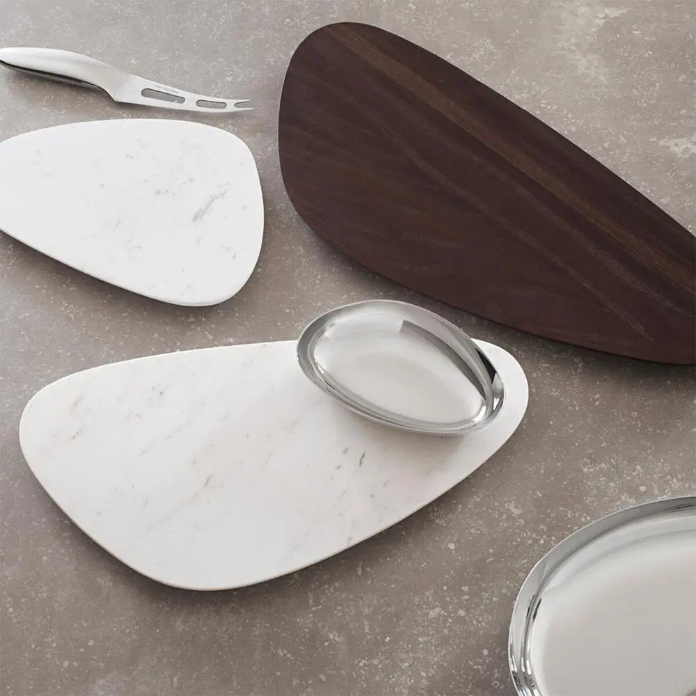 Georg Jensen Sky Large Wood Serving Board in a room with white plates set on top in a dining room with decanters and food