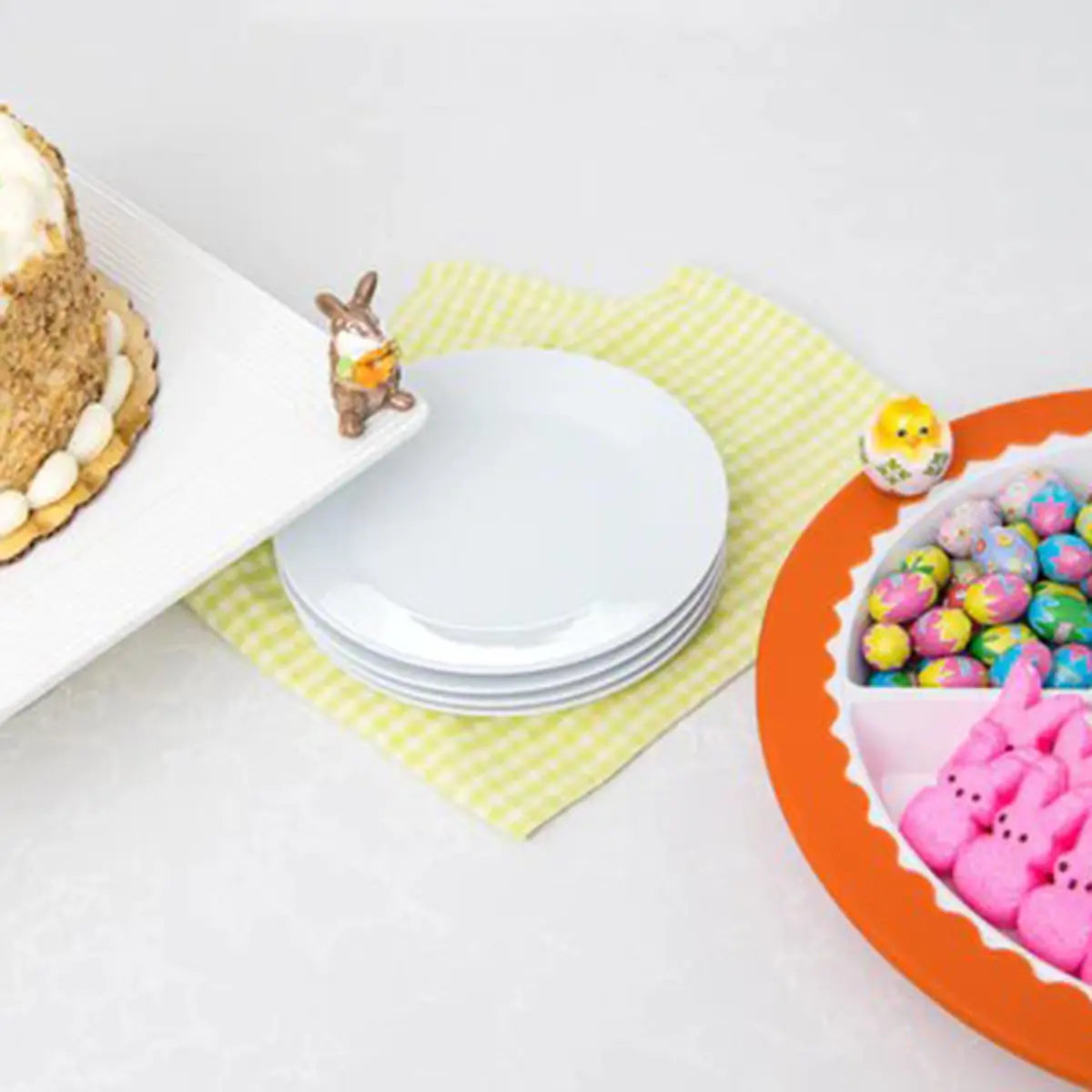 Nora Fleming One Cool Chick Mini on a orange tray with candy in a room with other plates