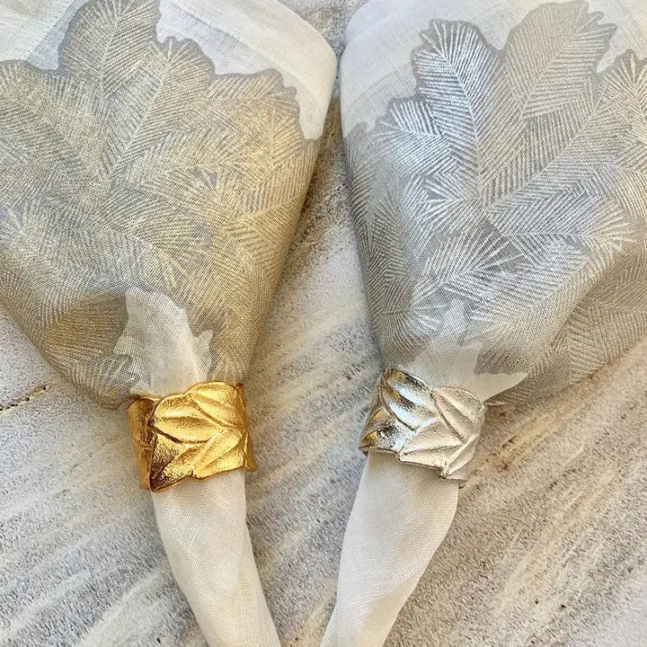 Bodrum Laurel Leaf Napkin Ring in Silver and Gold wrapped on a napkin