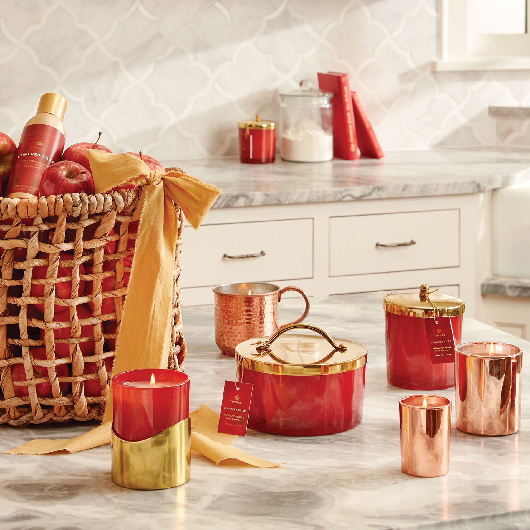 An image of Thymes Simmered Cider Harvest Red Medium Candle with Sleeve 8.5 oz