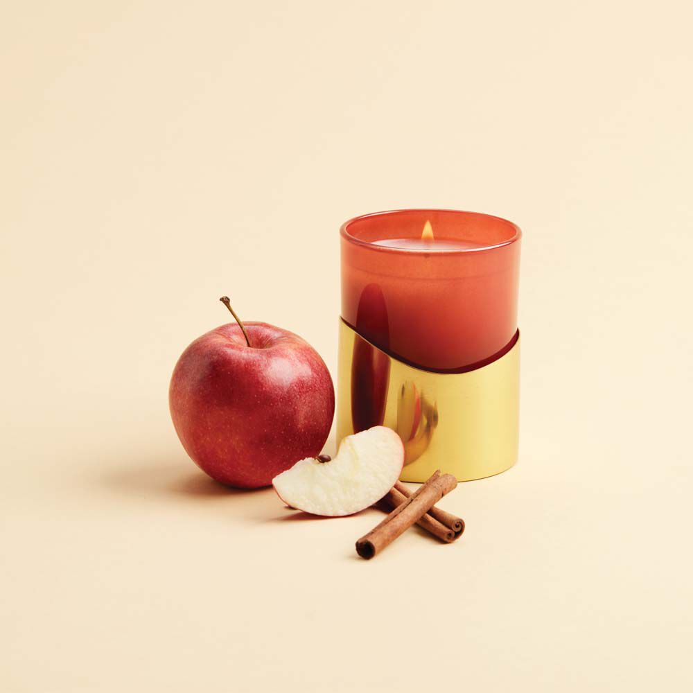 An image of Thymes Simmered Cider Harvest Red Medium Candle with Sleeve 8.5 oz