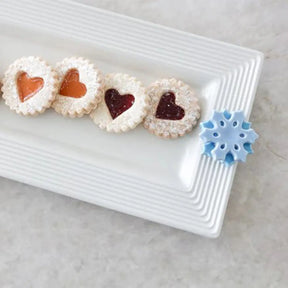 Nora Fleming Bread Tray with heart cookies and a blue snowflake mini attached