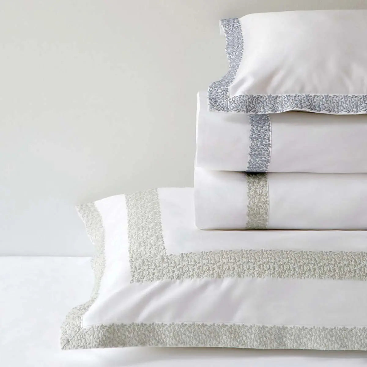 Bovi Malone Sheet Set and shams in various color stacked together