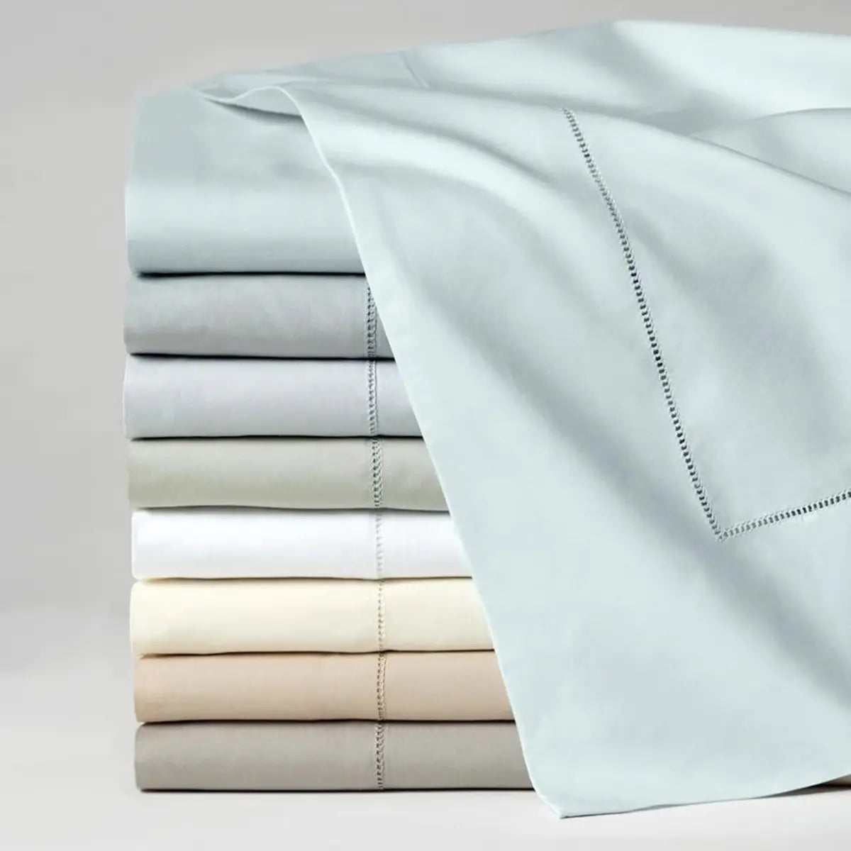Celeste Flat Sheet in various colors stacked together