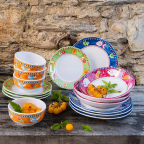 Vietri Campagna Melamine Pesce Bowls and plates outside on a table, with food.