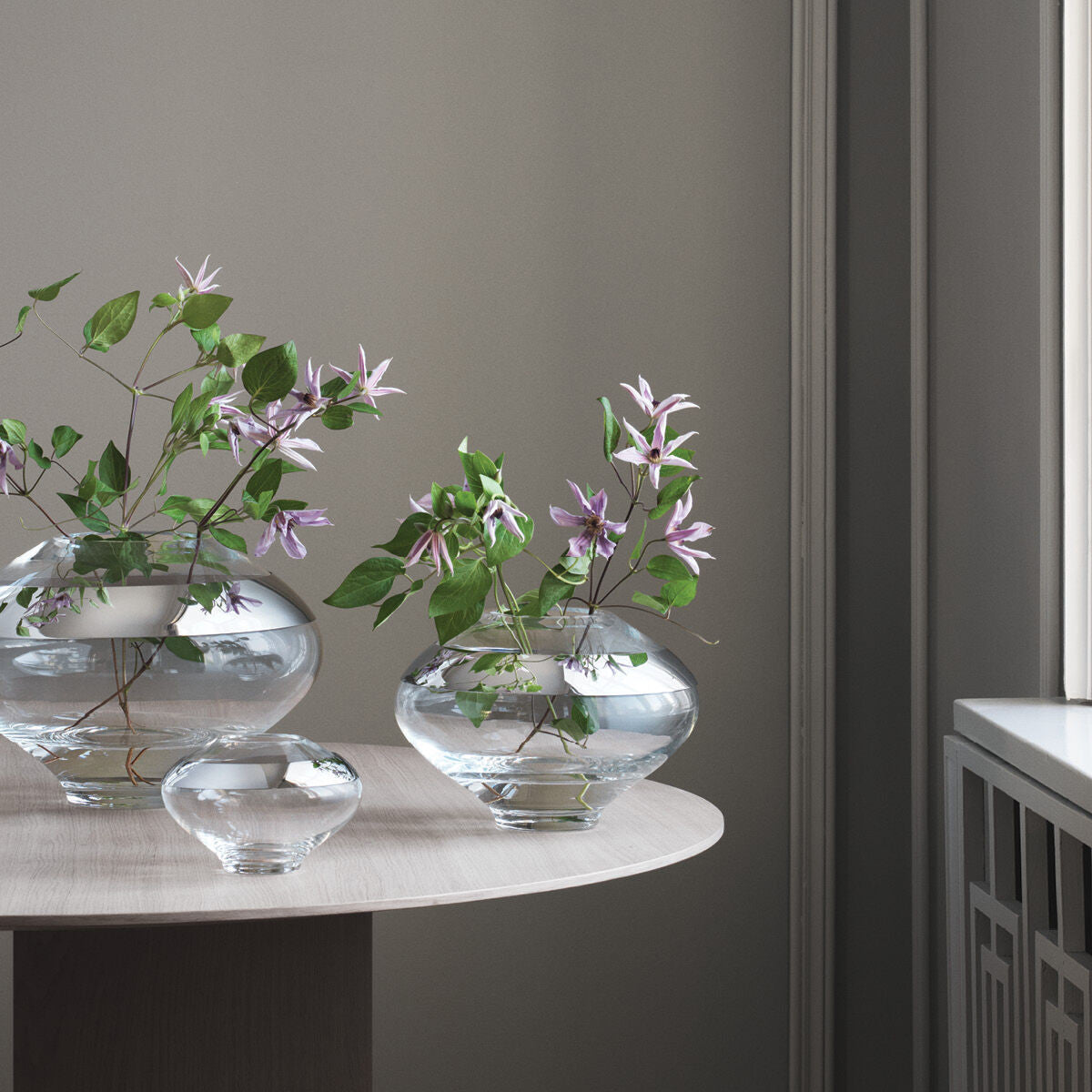 An image of Georg Jensen Duo Stainless Steel & Glass Round Vase