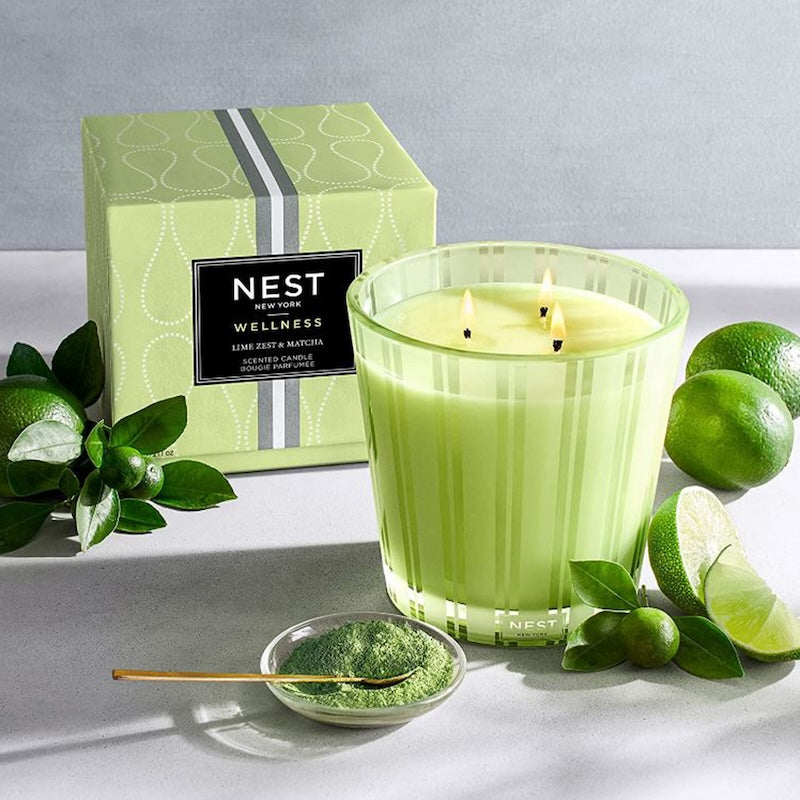 Image of Lime Zest candle with limes on a counter top