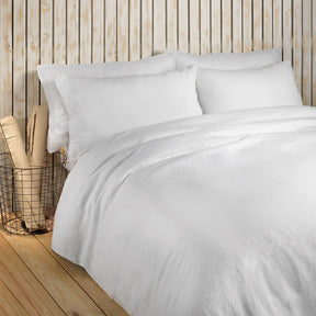 Amalia Home Maia Bedding Collection in White on a bed in a room