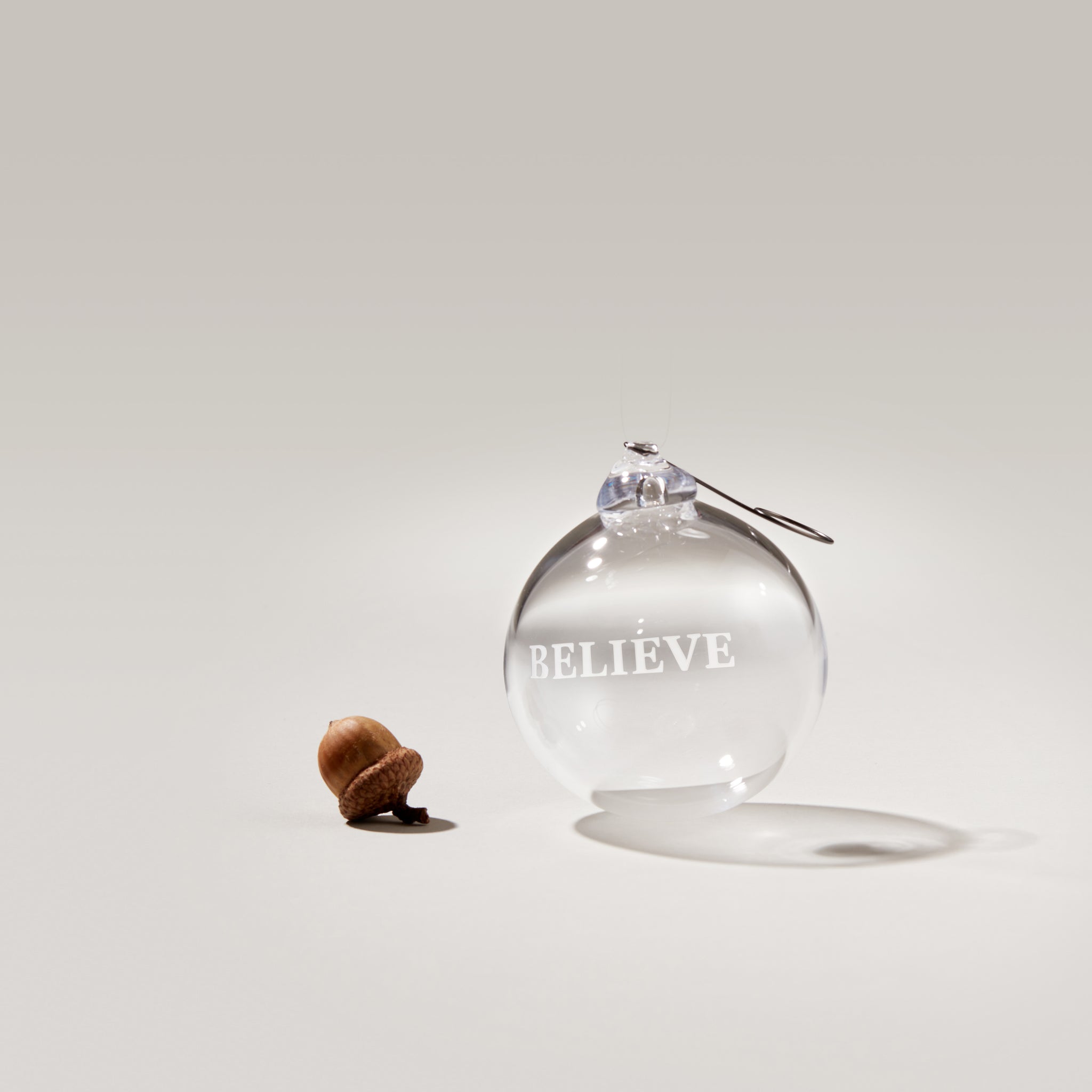 Simon Pearce Engraved "Believe" Round Ornament