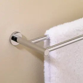 Valsan Porto Chrome Double Towel Rail in a room with a white towel hung on it.