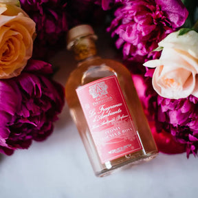 Antica Farmacista Peonia, Gardenia and Rosa Diffuser in a room with pink flowers