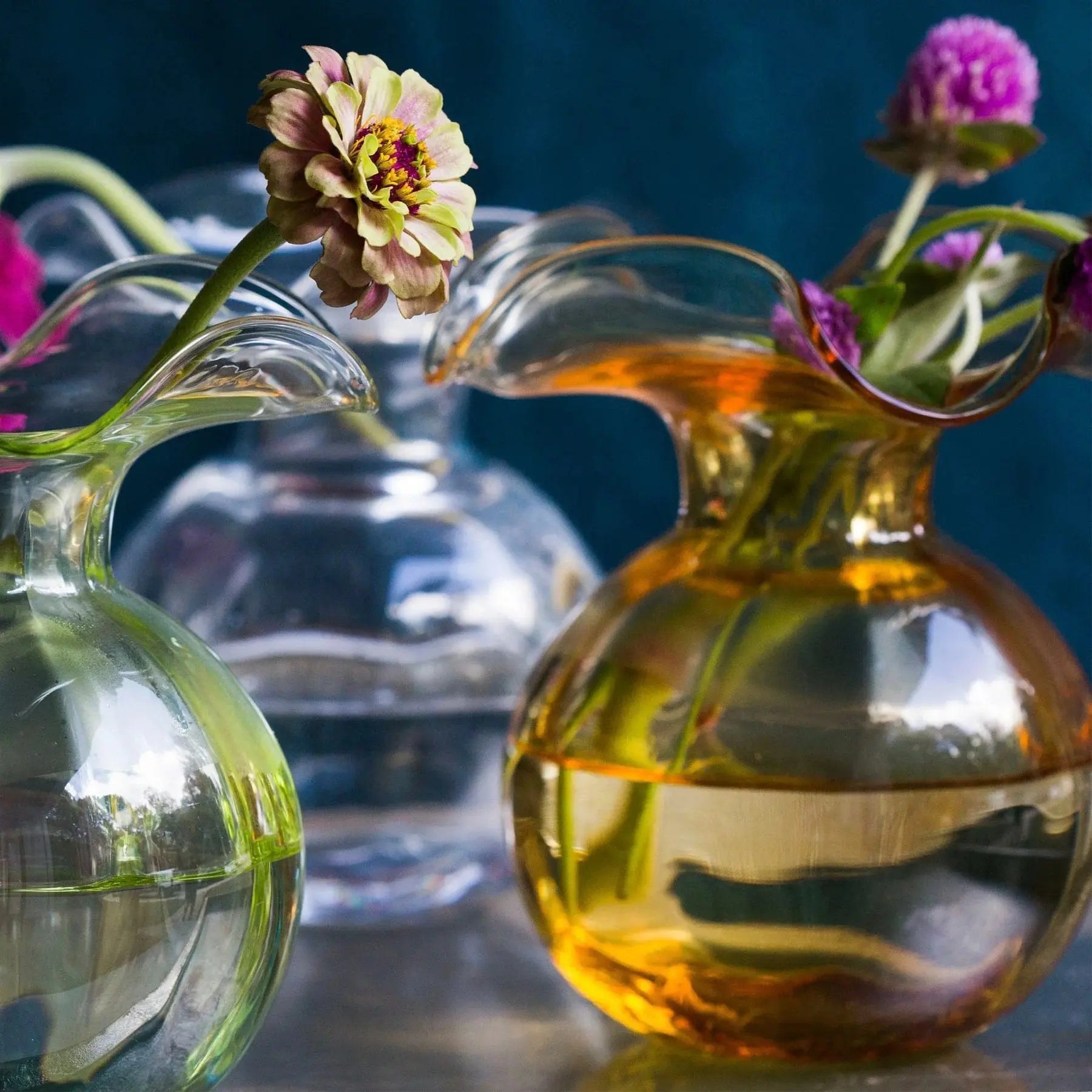 Vietri Hibiscus Amber Glass Bud Vase in a room