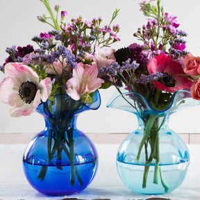 Vietri Hibiscus Aqua Glass Bud Vase in a room