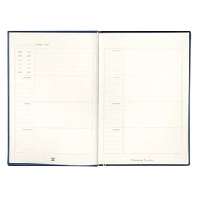 Hachette Christian Lacroix Nuit Paseo Undated Agenda Opened showing the weekly plan layout, monday, tuesday, wednesday, thursday, friday, saturday, sunday with the months in the left corner. 