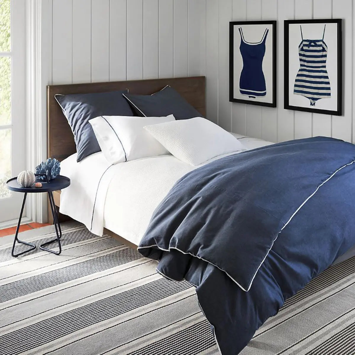 Dash and Albert Gunner Stripe Woven Cotton Rug in a bedroom