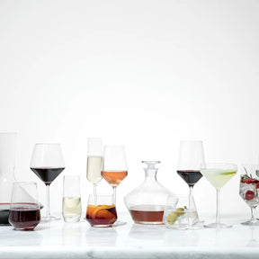 Filled Fortessa Tritan Pure Martini Glass with other filled glasses from the collection