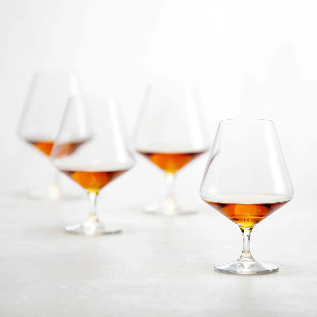 Four filled Fortessa Tritan Pure Cognac Glass