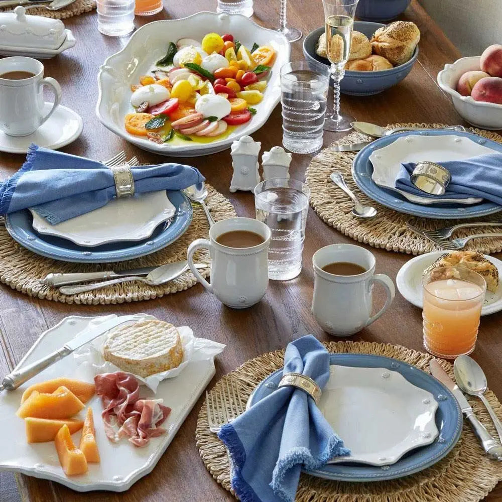 Juliska Straw Loop Natural Placemat on a set table with coffee and food