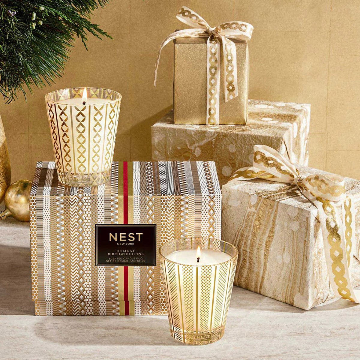 An image of Nest Fragrances Festive Holiday & Birchwood Pine Candle Duo Set