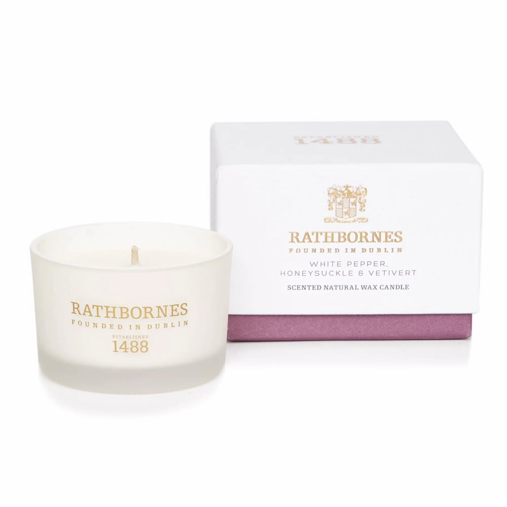 An image of Rathbornes White Pepper, Honeysuckle & Vetivert Travel Candle