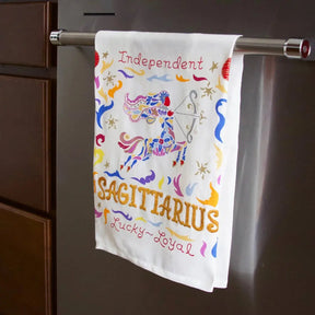 Catstudio Aries Dish Towel hung on the stove