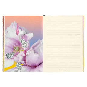Inside of Hachette Christian LaCroix Carnet D'artiste Paris A5 Medium Notebook with one page with flora print and other page ivory ruled