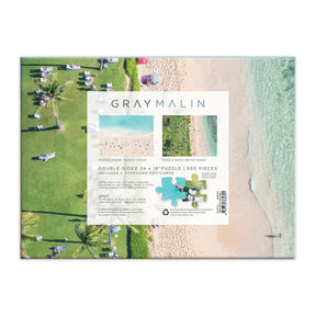 Backside of Hachette Gray Malin Hawaii 500 Piece Double Sided Puzzle Box. Includes large post card.