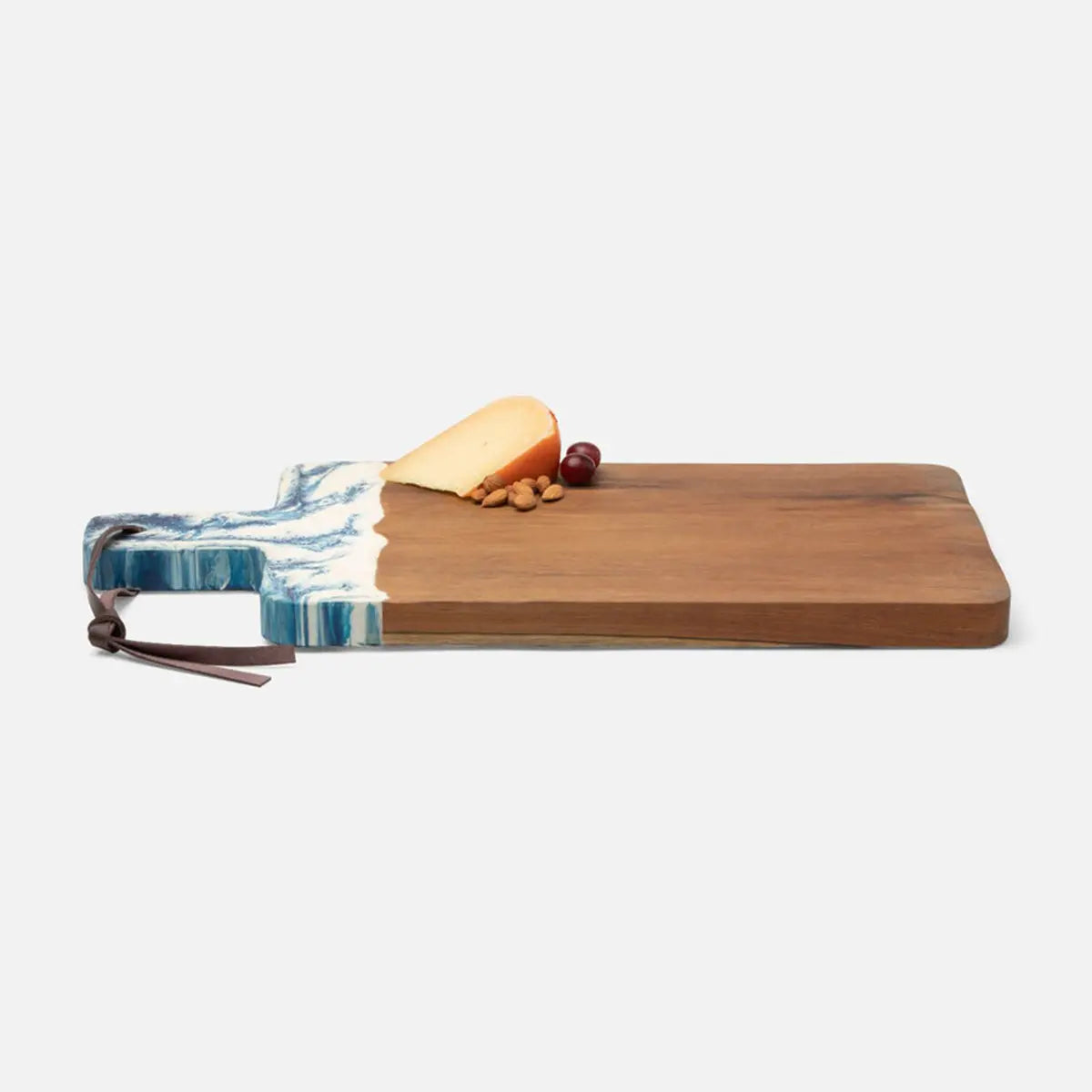 Blue Pheasant Austin Swirled Blue Resin and Natural Teak Serving Board in Medium size with cheese and nuts on top