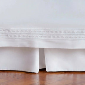 Bovi Simply Sateen Bed Skirt in White on a bed