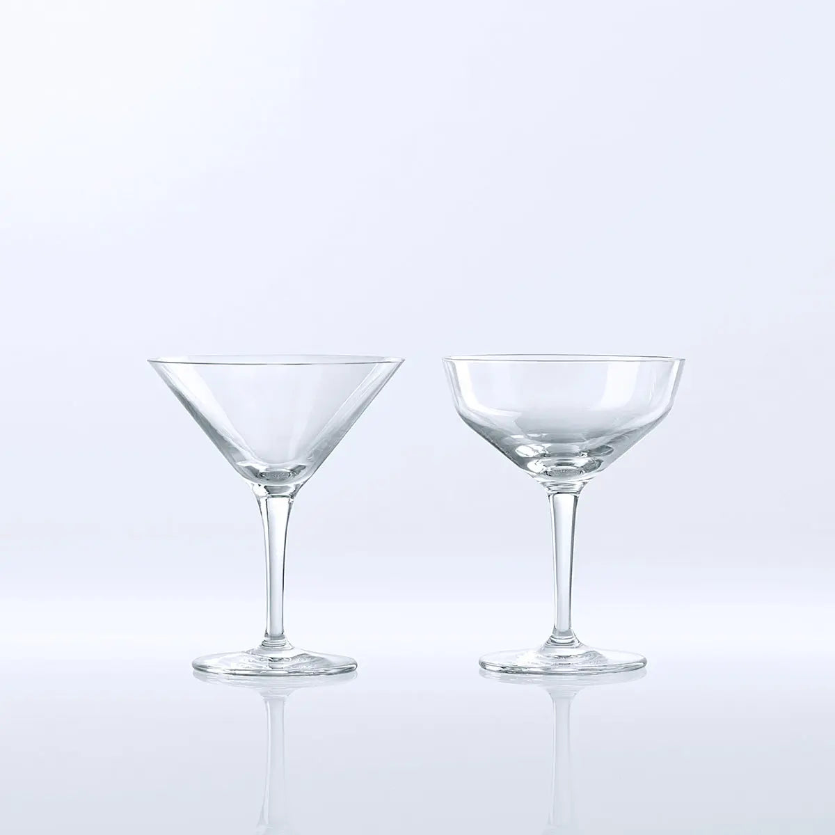 Empty Fortessa Classic Bar Martini Glass set next to another glass