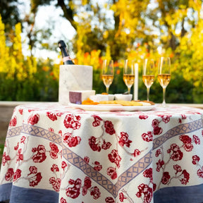 Caravan Cherry Blossom Tablecloth on a table outside by the trees