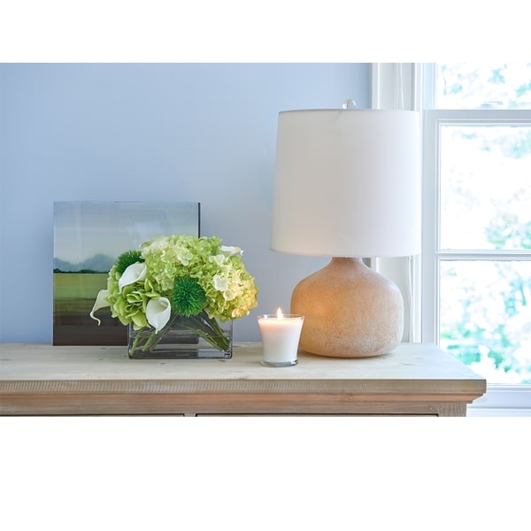 An image of Diane James BLOOMS Hydrangea and calla lily bouquet in glass rectangle