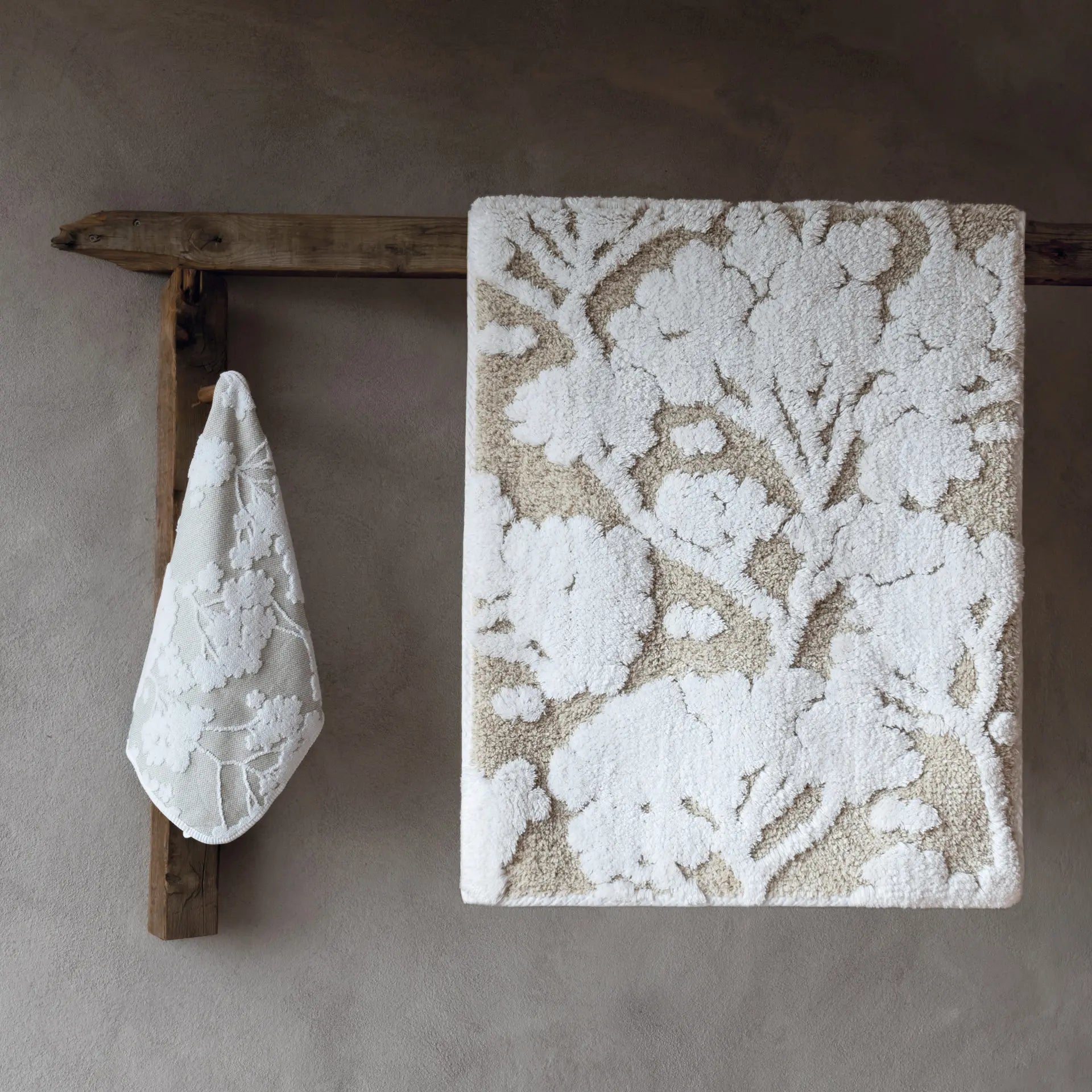 Graccioza Eden Bath Rug in White hung on the wall in the bathroom