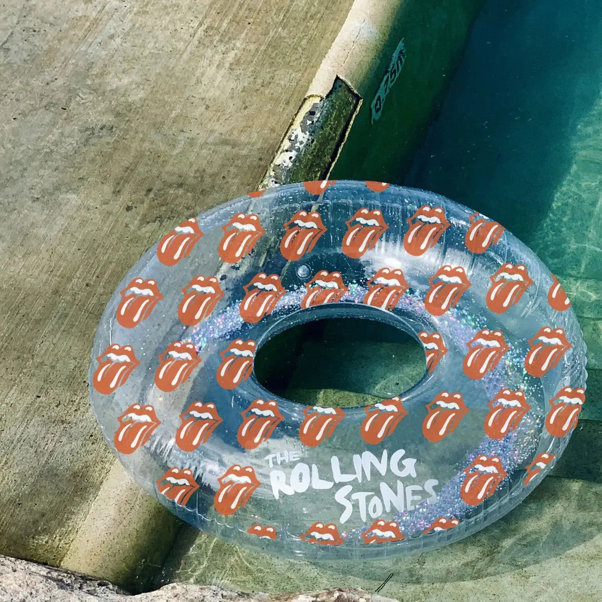 An image of Sunnylife Glitter Rolling Stones Lips Pool Ring