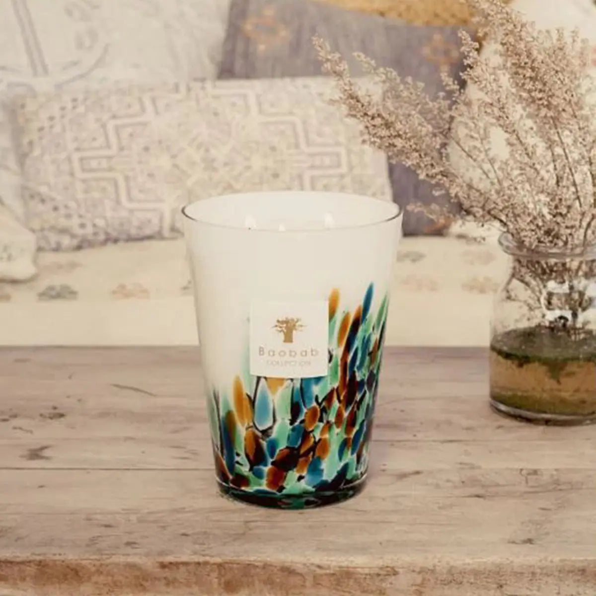 Baobab Collection Max 16 Rainforest Amazonia Candle set on a wood coffee table in a room 