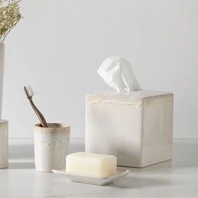 Casafina Taormina Stoneware Tissue Box in White set next to the toothbrush holder and soap dish in the collection