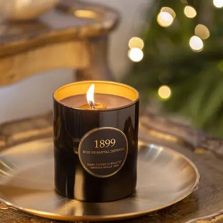 Cereria Molla 1899  Bois de Santal Imperial Gold Edition eight ounce Candle on a tray in a room