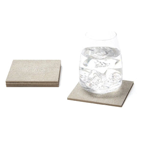 Blue Pheasant Henry Sand Coasters with a glass of water