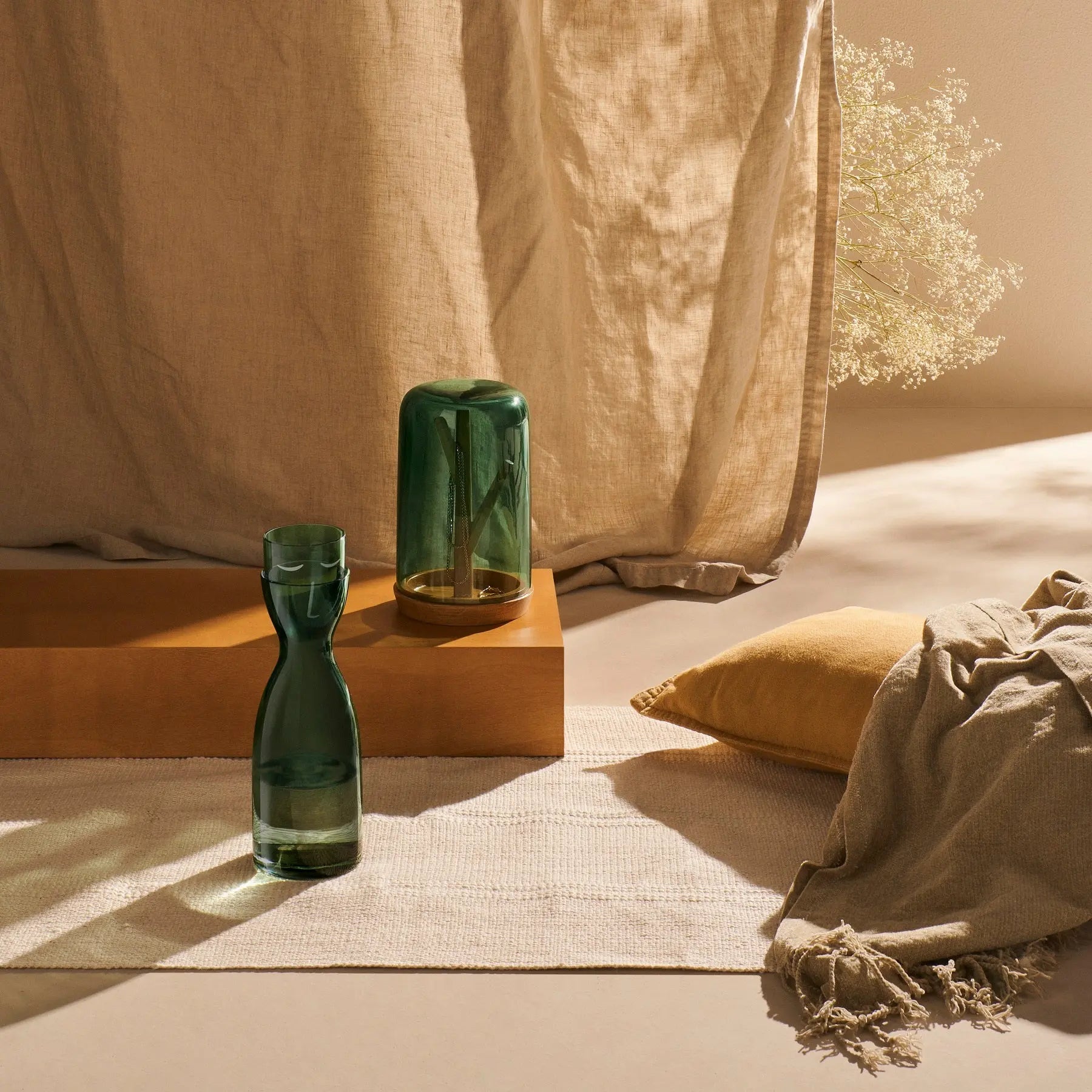 Filled Mister and Missus Night Smoked Green Tall Water Set in a room with beige curtains and home decor items