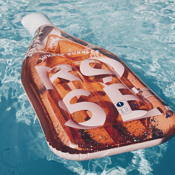 An image of Sunnylife Luxe Lie-On Float Rose Bottle